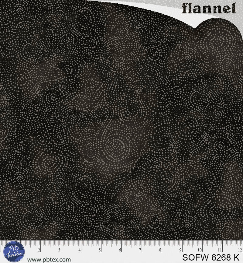 Black flannel fabric with a subtle pattern, shown with a ruler at the bottom for scale.