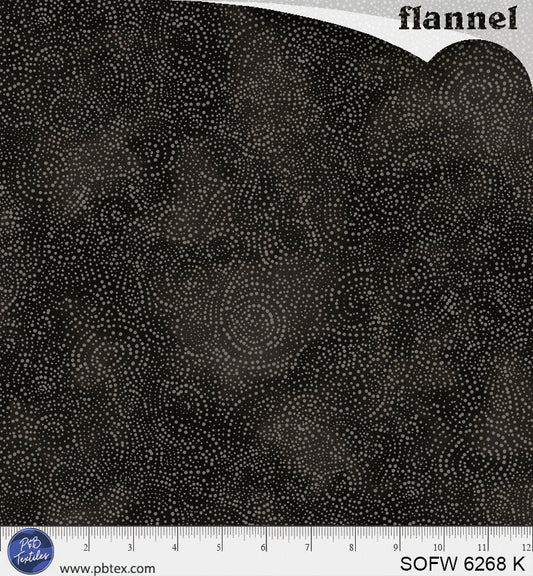 Black flannel fabric with a subtle pattern, shown with a ruler at the bottom for scale.
