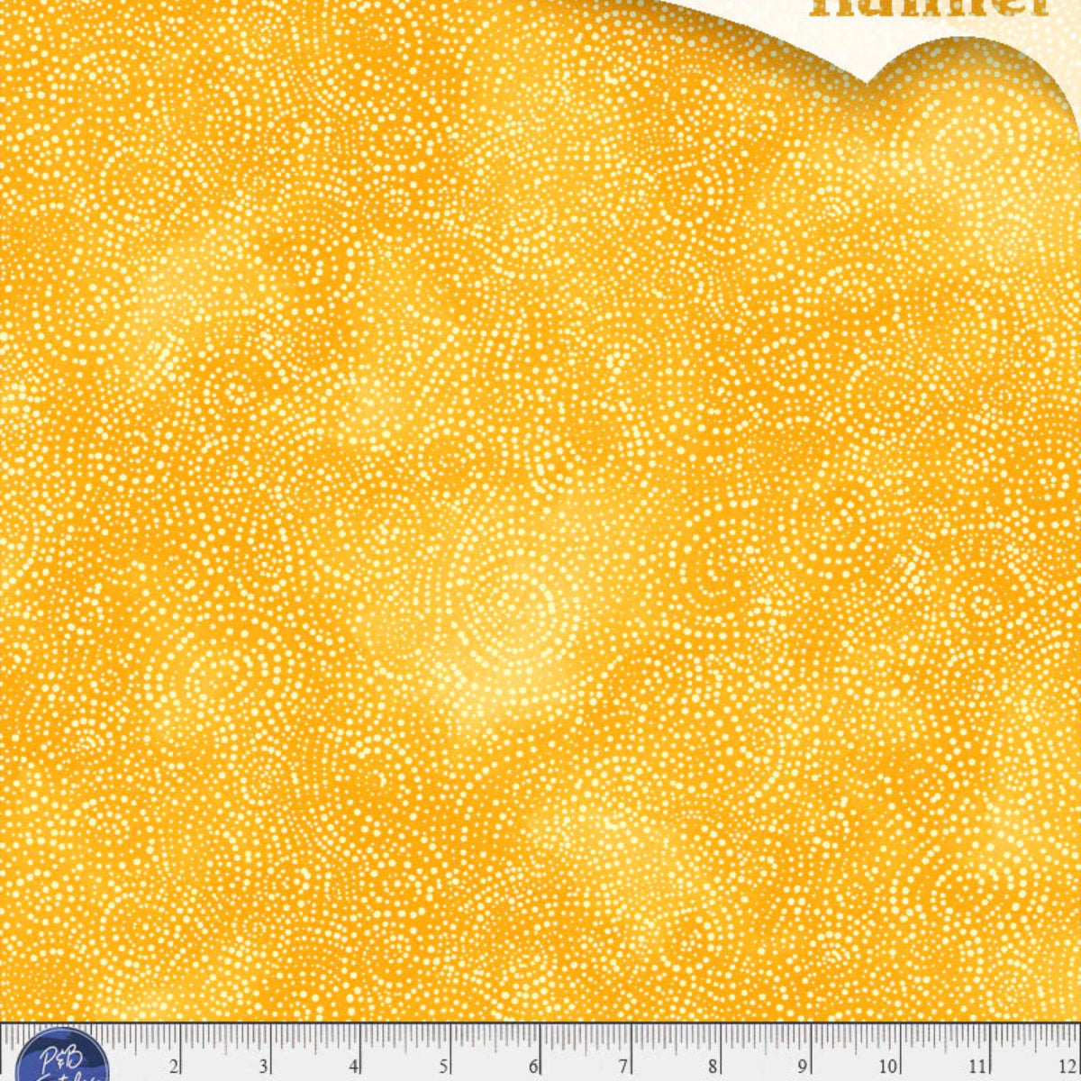 Yellow flannel fabric with a small white pattern and a ruler at the bottom for scale.