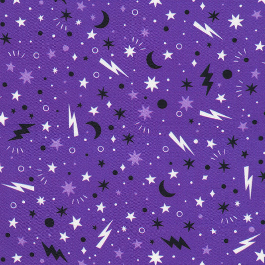 Purple fabric with black, white, and gray star, moon, and lightning bolt patterns