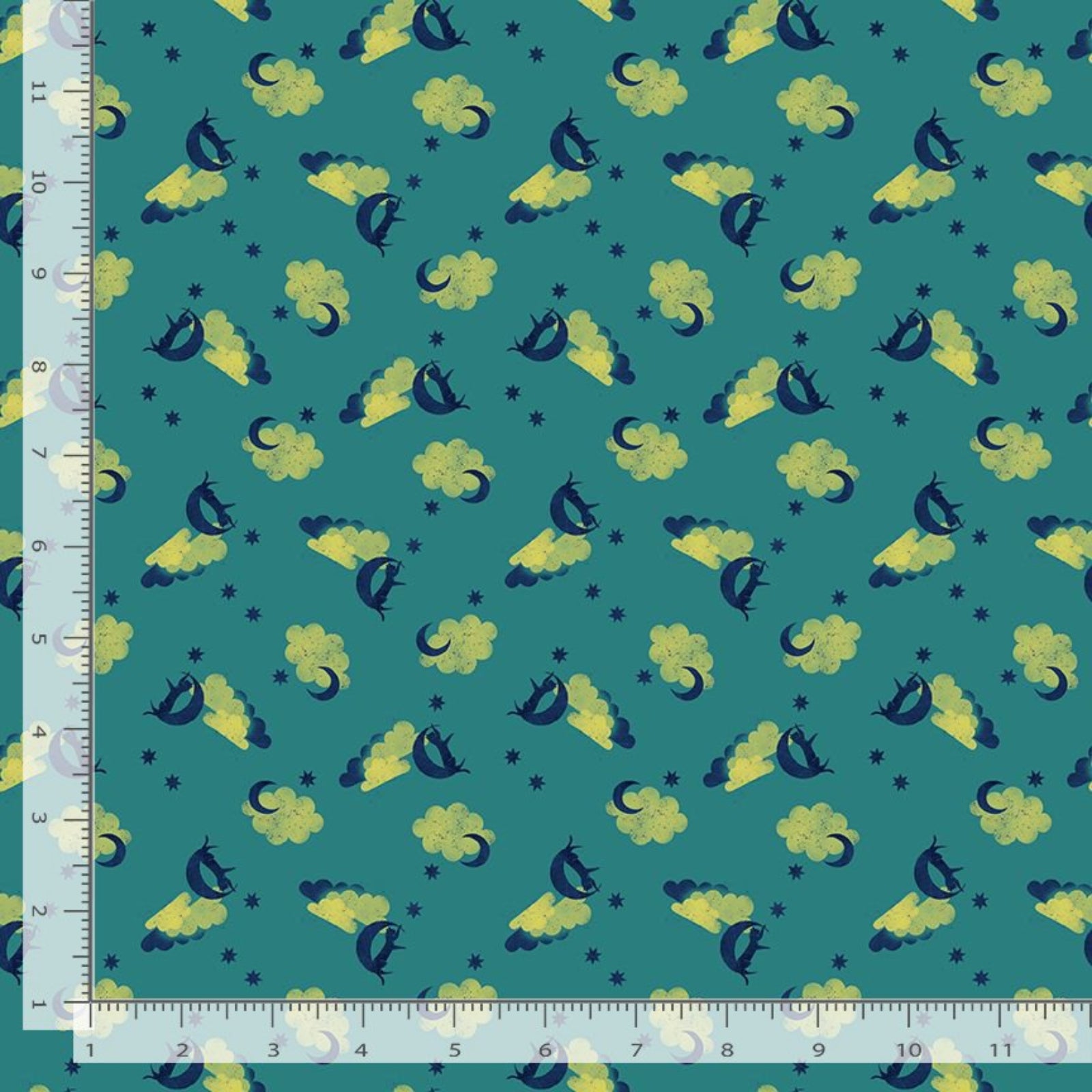 Patterned fabric with cartoon characters on a teal background, measured by a ruler.