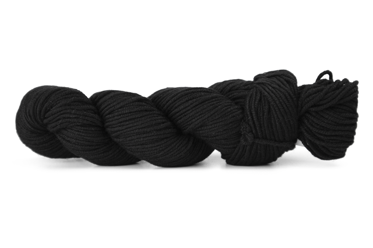 A skein of black twisted yarn photographed on a clean white background.