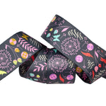 Decorative ribbon with floral and botanical patterns on a white background