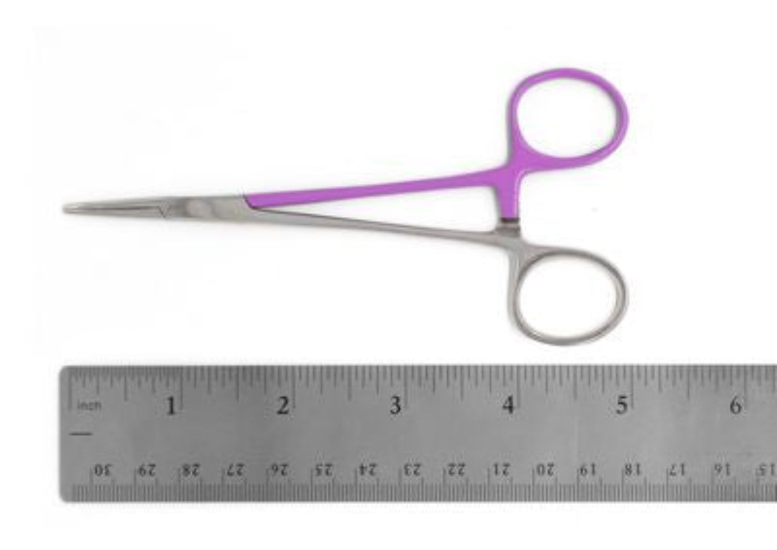 Small silver hemostat with purple handles placed above a metal ruler on a white background.