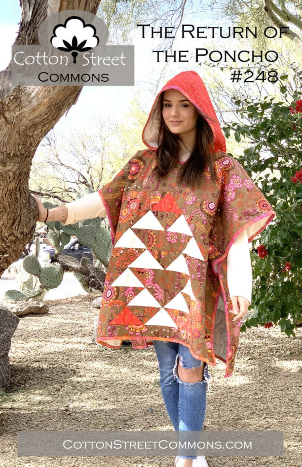 Woman wearing a floral poncho with a hood in a natural setting, promoting Cotton Street Commons.