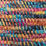 Detailed close‑up of a Tunisian crochet sample worked in variegated yarn, highlighting the stitch texture and color variation.