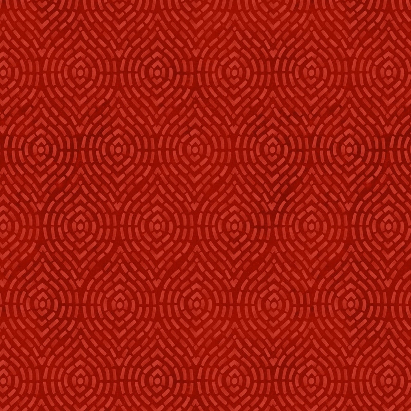 A close-up of a red patterned fabric or material swatch with a repeating geometric design in slightly darker red tones.