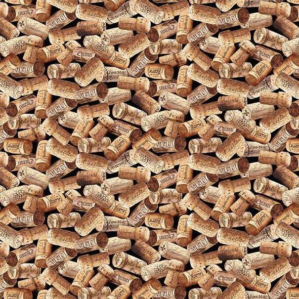 Tossed wine corks on a black cotton fabric.