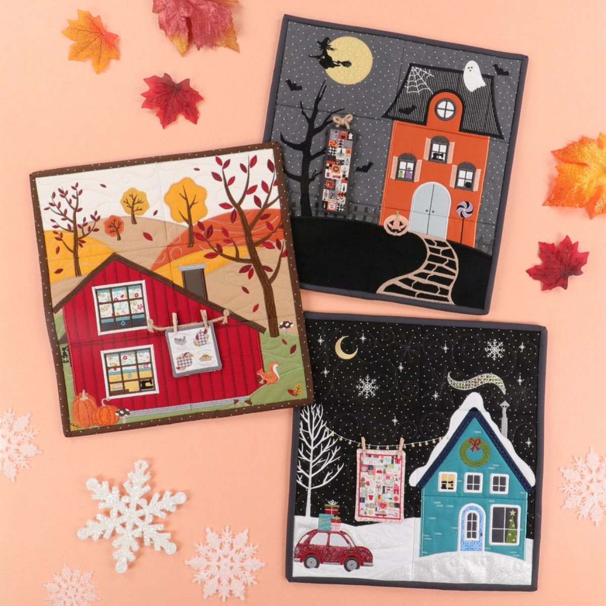 Three seasonal-themed fabric panels on a pink background with autumn and winter elements.