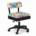 Colorful sewing-themed chair with a white background