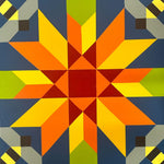 Colorful geometric barn quilt block featuring a red center star with blue, green, yellow, and black accents.