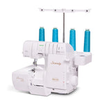 A white serger sewing machine with four blue thread cones on a stand, photographed on a clean white background. The machine features the brands 'Baby Lock' and 'Serenity' on its body.