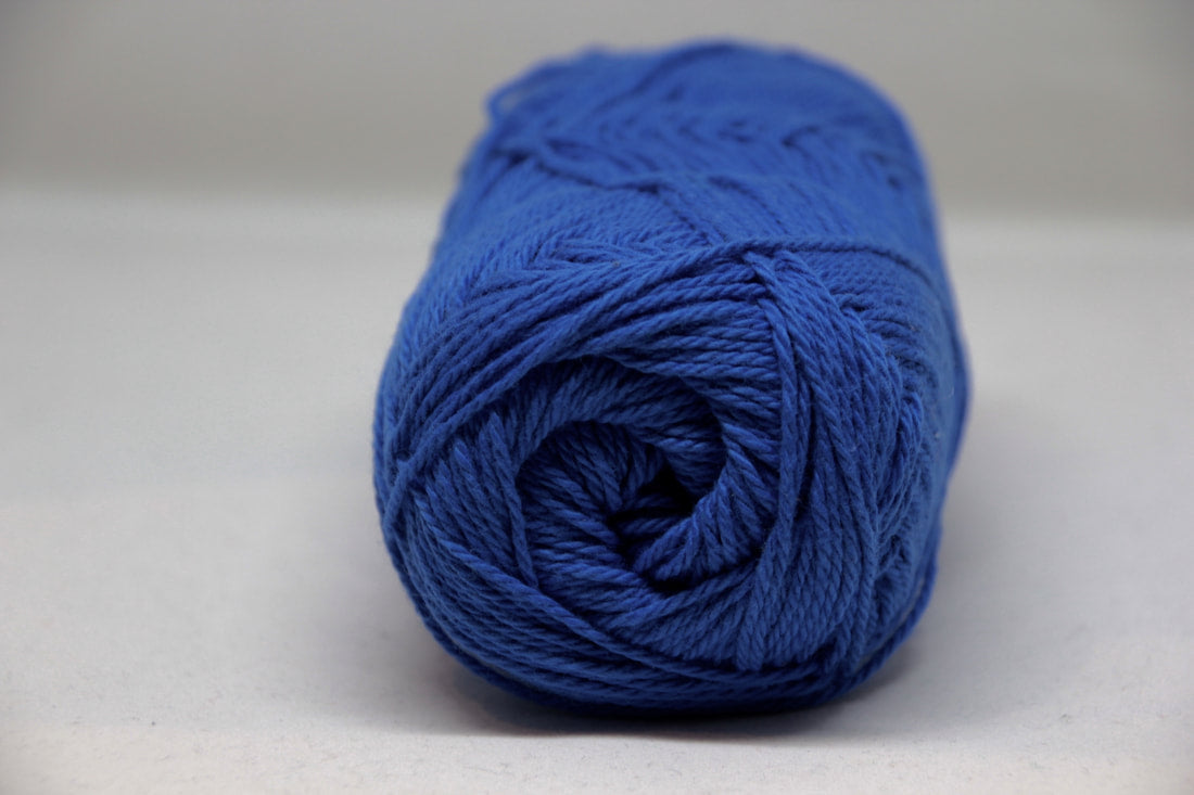 Blue skein of yarn on a white background