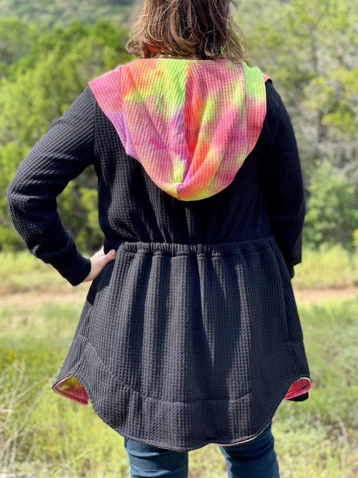 Back view of the Camden Cardigan showing the hood and waist shaping on a finished garment