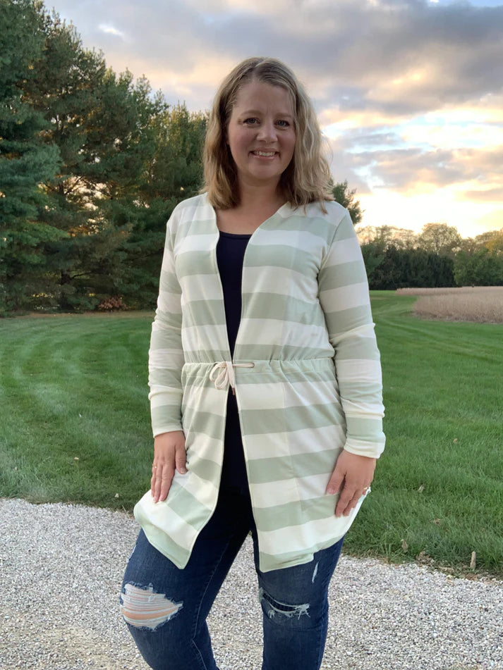 Front view of the Camden Cardigan worn outdoors, showing the garment’s waist shaping and open‑front design