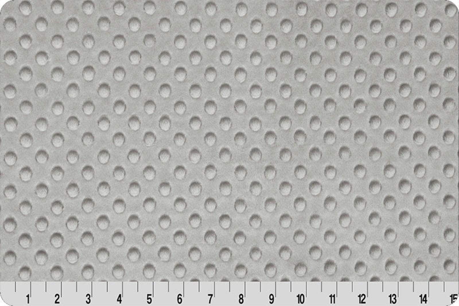 Gray textured surface with a ruler at the bottom