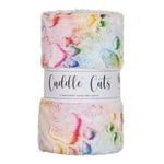 A roll of Cuddle Cuts 2 Yard Cuddly fuzzy fabric grease in a pastel multicolor pattern with pink, yellow, green, and blue marbling on a white base, wrapped in a white paper band.