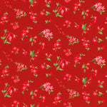 Red fabric with a repeating pattern of small pink flowers and green leaves.
