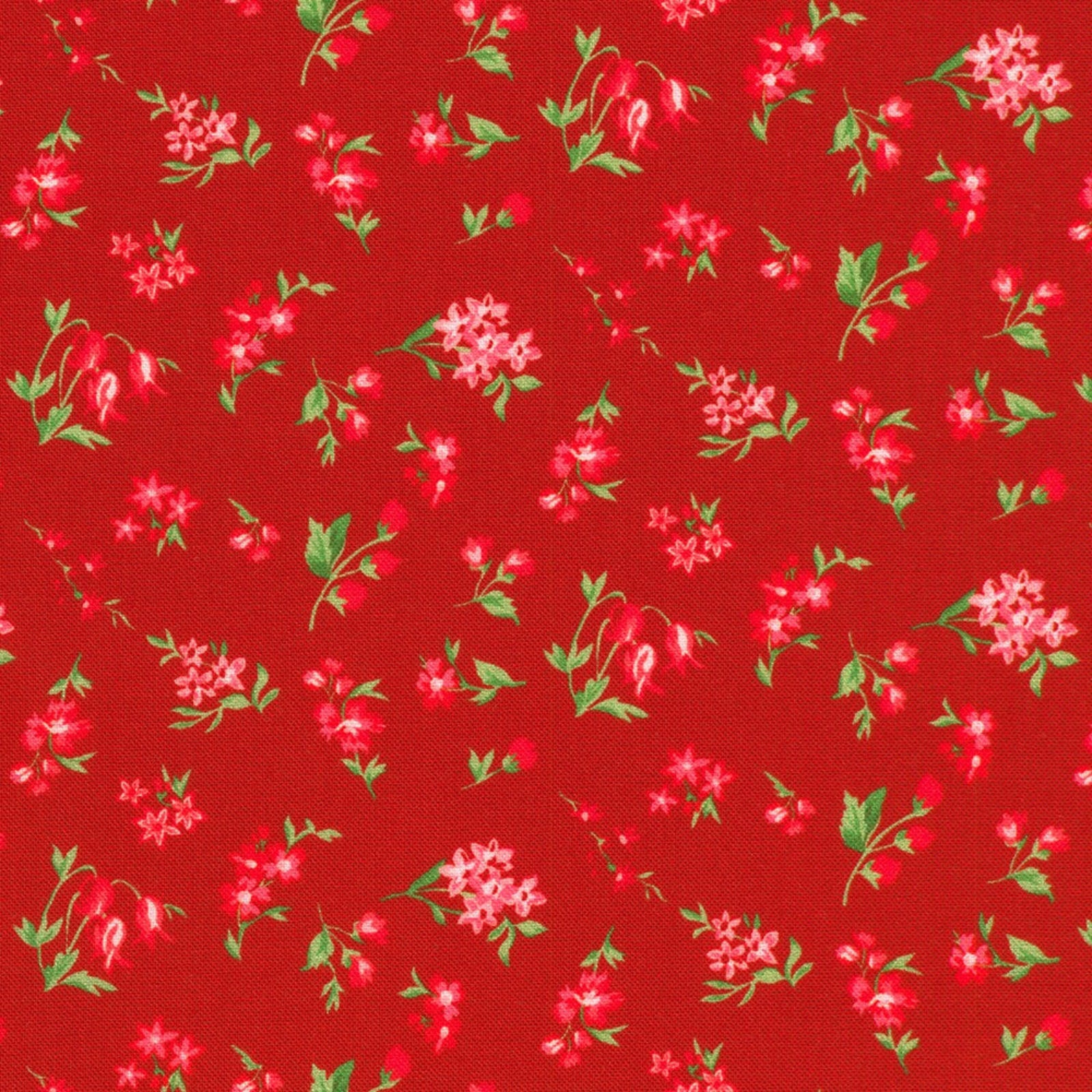 Red fabric with a repeating pattern of small pink flowers and green leaves.