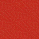 A close-up of a red fabric or material swatch with a repeating pattern of small white and pink polka dots.