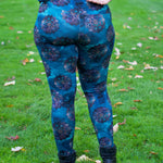 Back view of the Foxglove Leggings worn outdoors, showing the fit and waistband detail against a natural setting