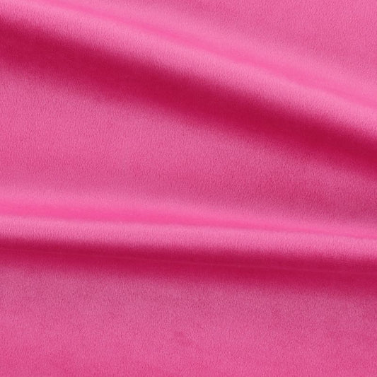 Close-up of pink velvet fabric with folds to show texture