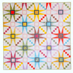 Colorful quilt with star patterns on a white background