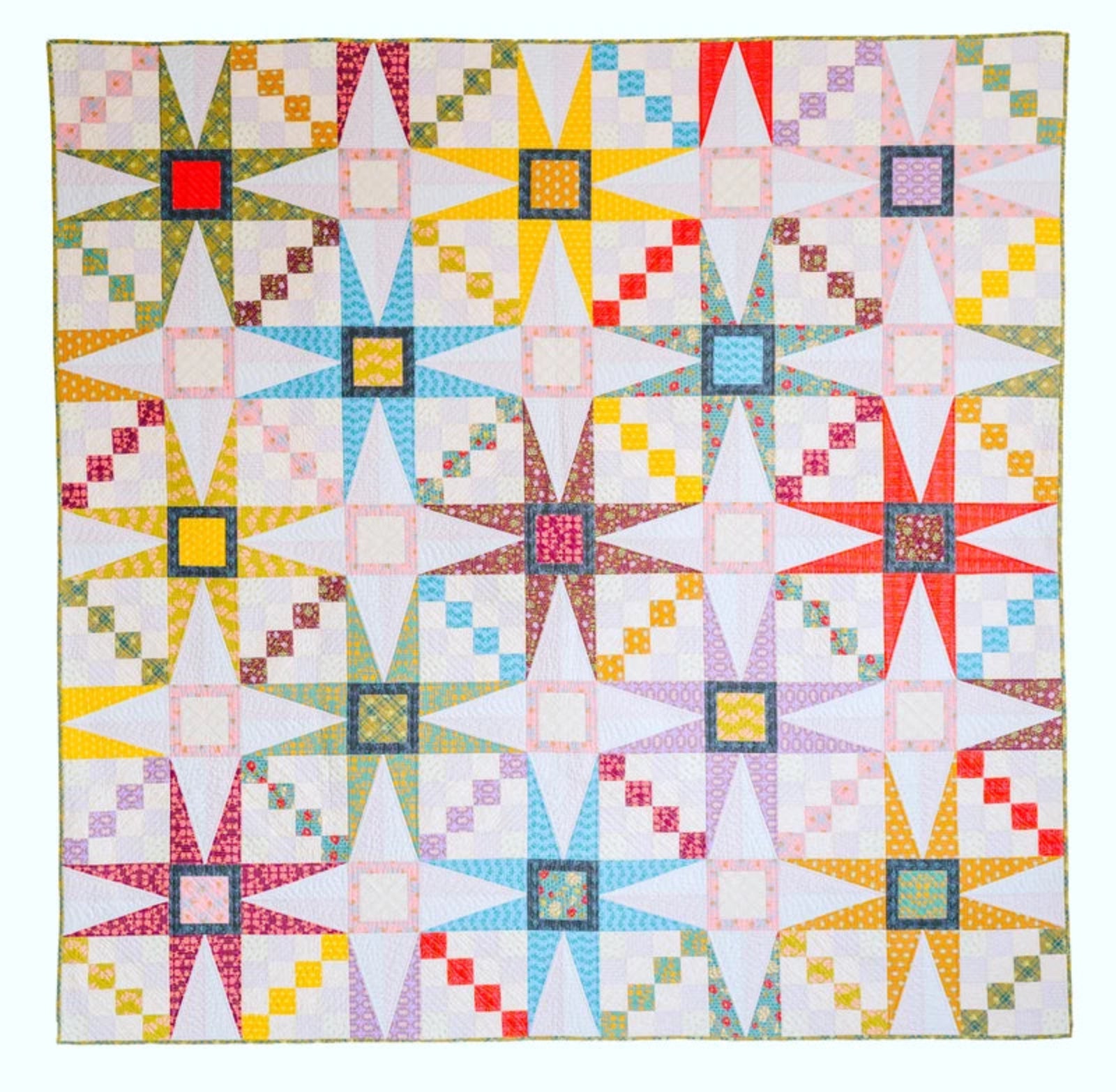 Colorful quilt with star patterns on a white background