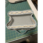 Finished Pack It In 2.0 mesh bag sewn by Sonia, shown on a cutting mat with the mesh panel and fabric edging visible.