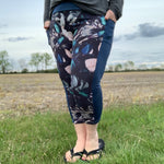 Outdoor view of the Pittsburgh Walking Pants sewn in a patterned knit with solid side panels, worn with a long‑sleeve top in a rural field setting