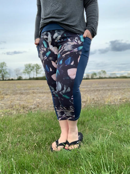 Outdoor view of the Pittsburgh Walking Pants sewn in a patterned knit with solid side panels, worn with a long‑sleeve top in a rural field setting