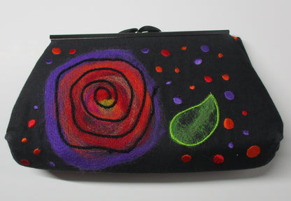 Black clutch with a colorful felted spiral design created using the PunchWork tool.