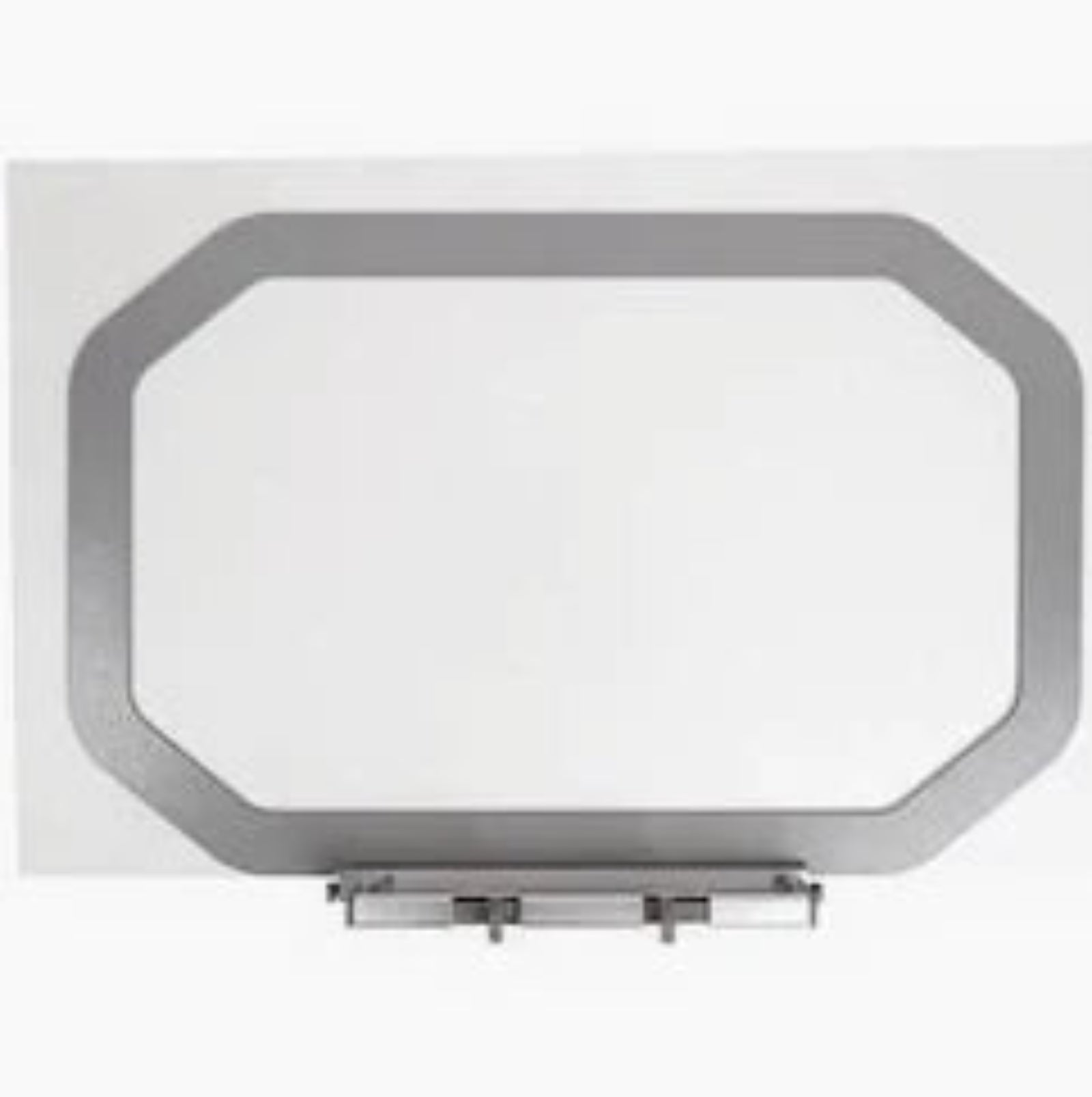 A rectangular wall mirror with an octagonal frame in a metallic silver finish, mounted on a white wall.