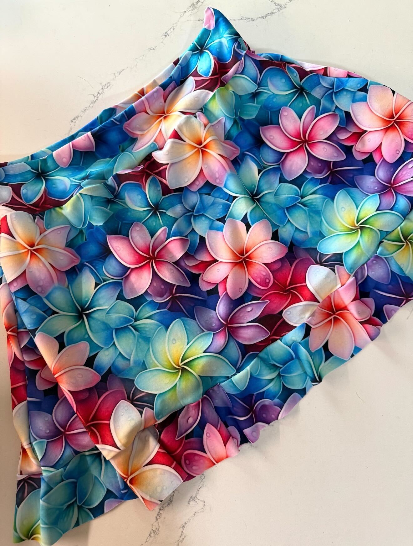 Close‑up of the vibrant floral fabric used for the handmade skort in the Sulky Tee & Skort Workshop.