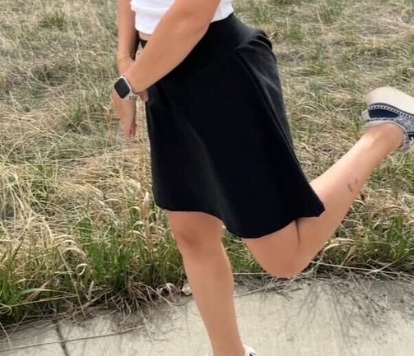 Person wearing a handmade skort from the Sulky Tee & Skort Workshop, shown in a side view