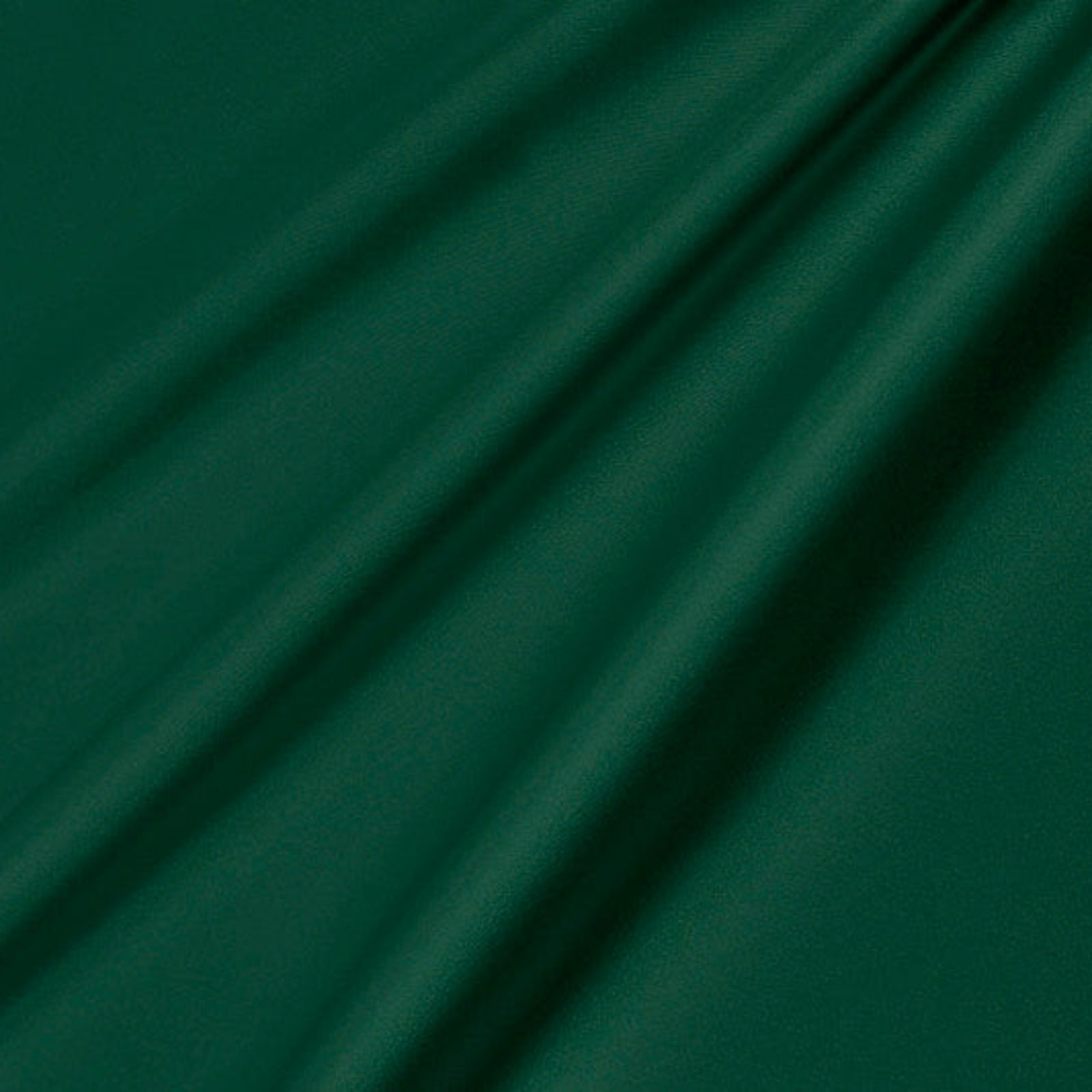 Dark green fabric with a smooth texture and soft diagonal folds.