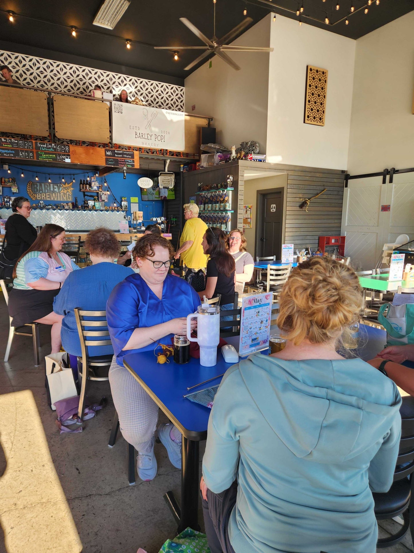 Main floor of Barley Pop Brewing with people gathered at tables for Stitch ’n Bitch