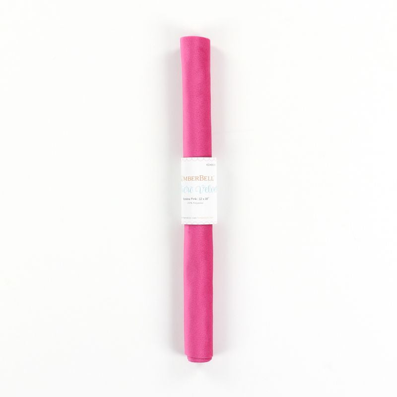Pink velvet fabric in a roll