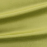 Close-up of green velvet fabric with folds to show texture