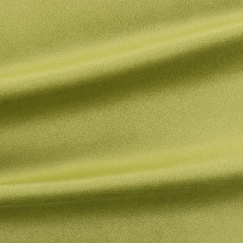 Close-up of green velvet fabric with folds to show texture