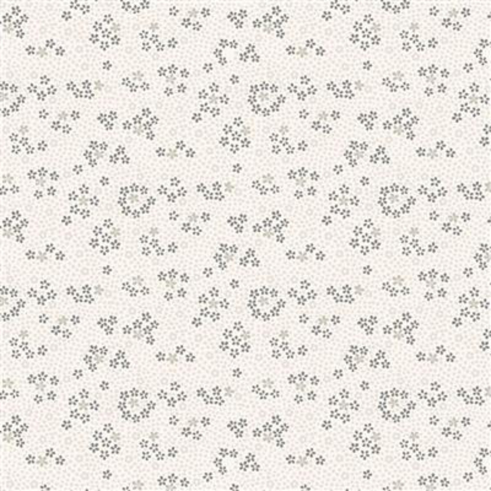 A close-up of a fabric pattern featuring small, scattered dark gray floral motifs on a warm off-white background.